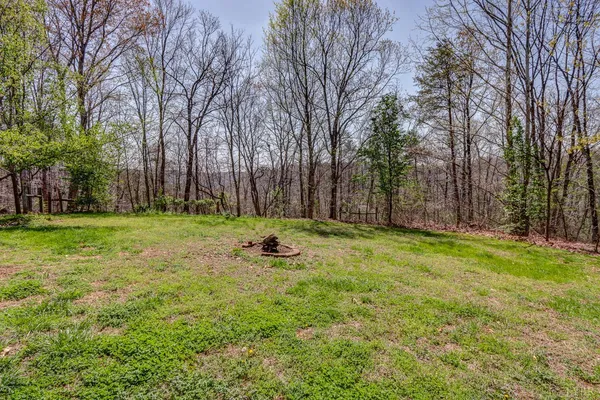 a view of a backyard of the house