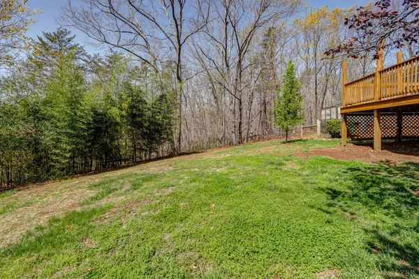 a view of a house with a yard covered in snow