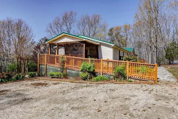 a view of a yard with a forest