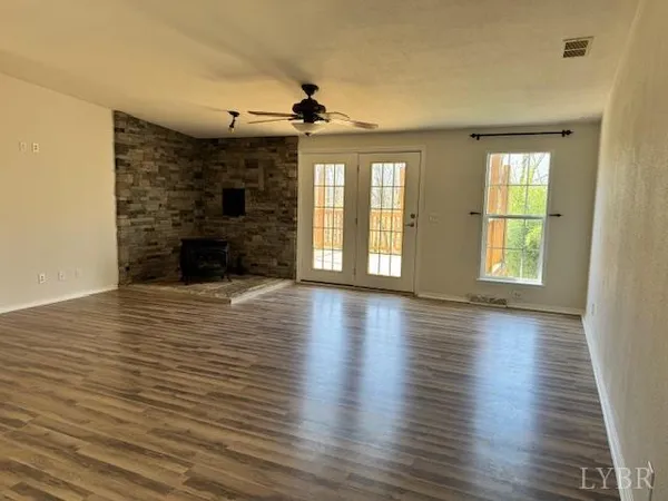 a kitchen with stainless steel appliances a refrigerator and a stove top oven