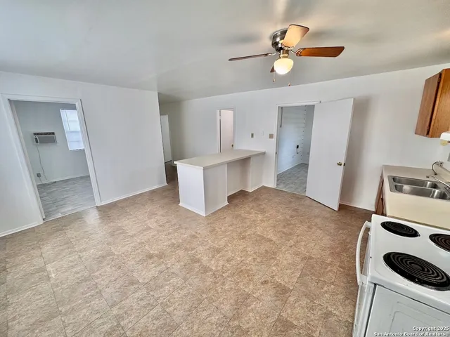 a view of kitchen and sink