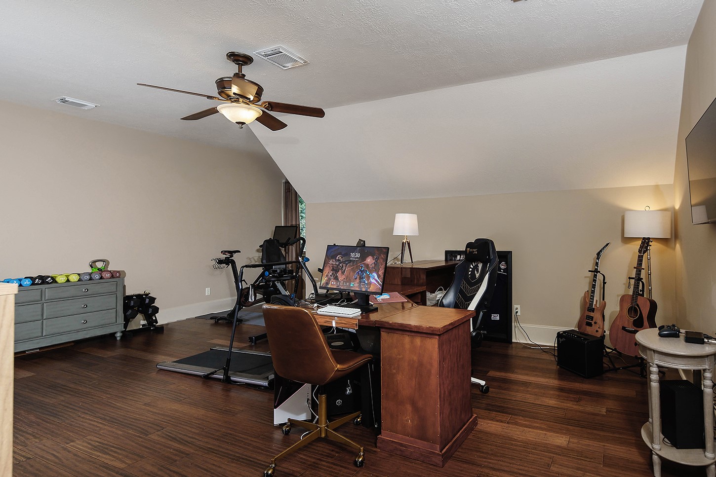 119 Angel Leaf Road The Woodlands, TX 77380 - Photo 37 of 50 a view of a workspace with furniture and wooden floor