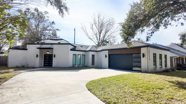 a front view of a house with a garage