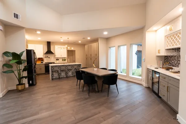 a living room with stainless steel appliances kitchen island granite countertop furniture and a kitchen view