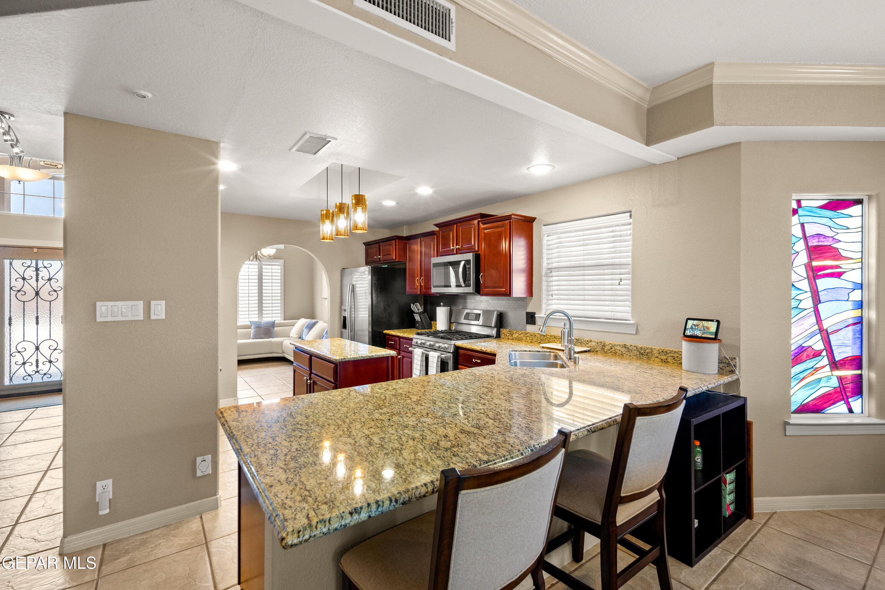 6705 Pearl Ridge Drive El Paso, TX 79912 - Photo 14 of 58 a view of a dining room with furniture and a kitchen