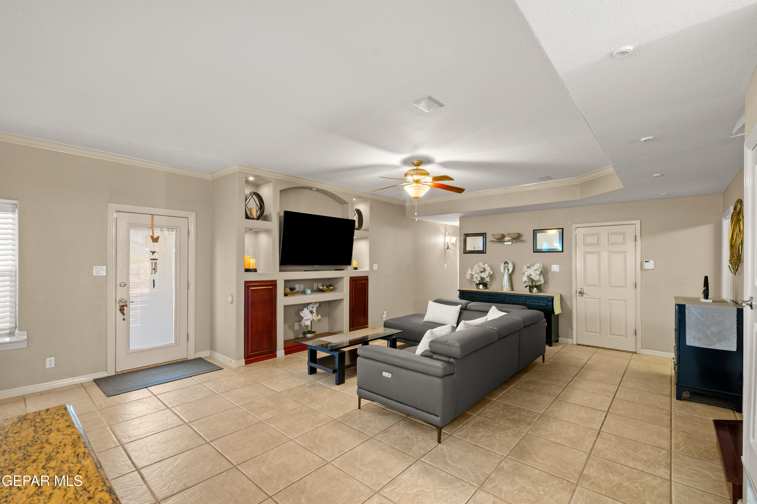 6705 Pearl Ridge Drive El Paso, TX 79912 - Photo 15 of 58 a living room with furniture and a flat screen tv