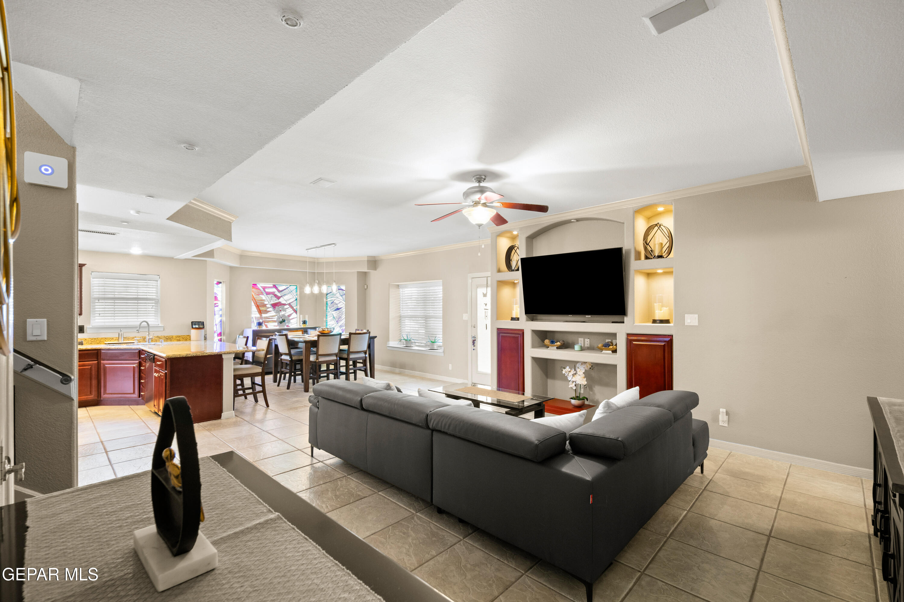 6705 Pearl Ridge Drive El Paso, TX 79912 - Photo 16 of 58 a living room with furniture and a flat screen tv