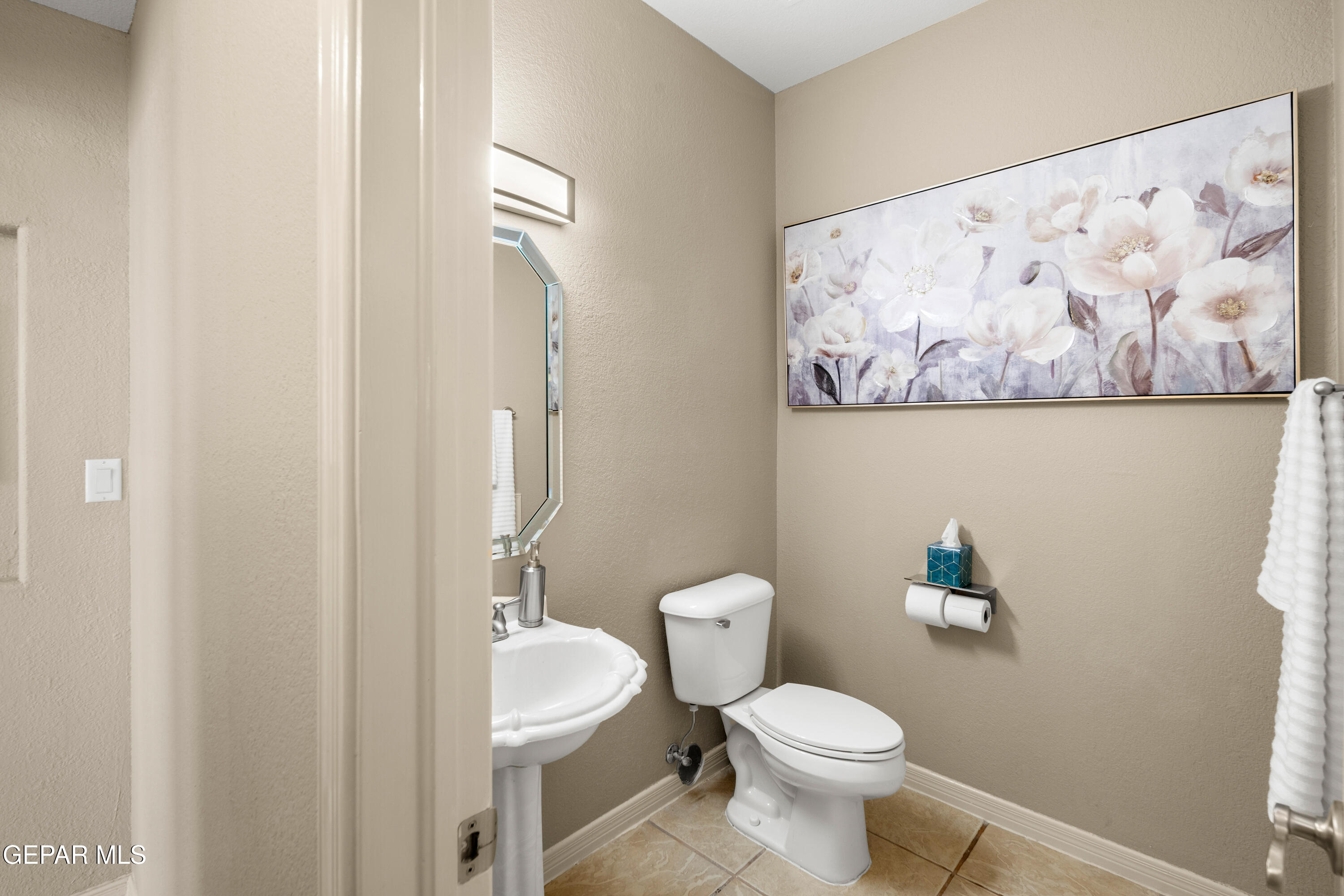 6705 Pearl Ridge Drive El Paso, TX 79912 - Photo 20 of 58 a white toilet sitting next to a bathroom sink
