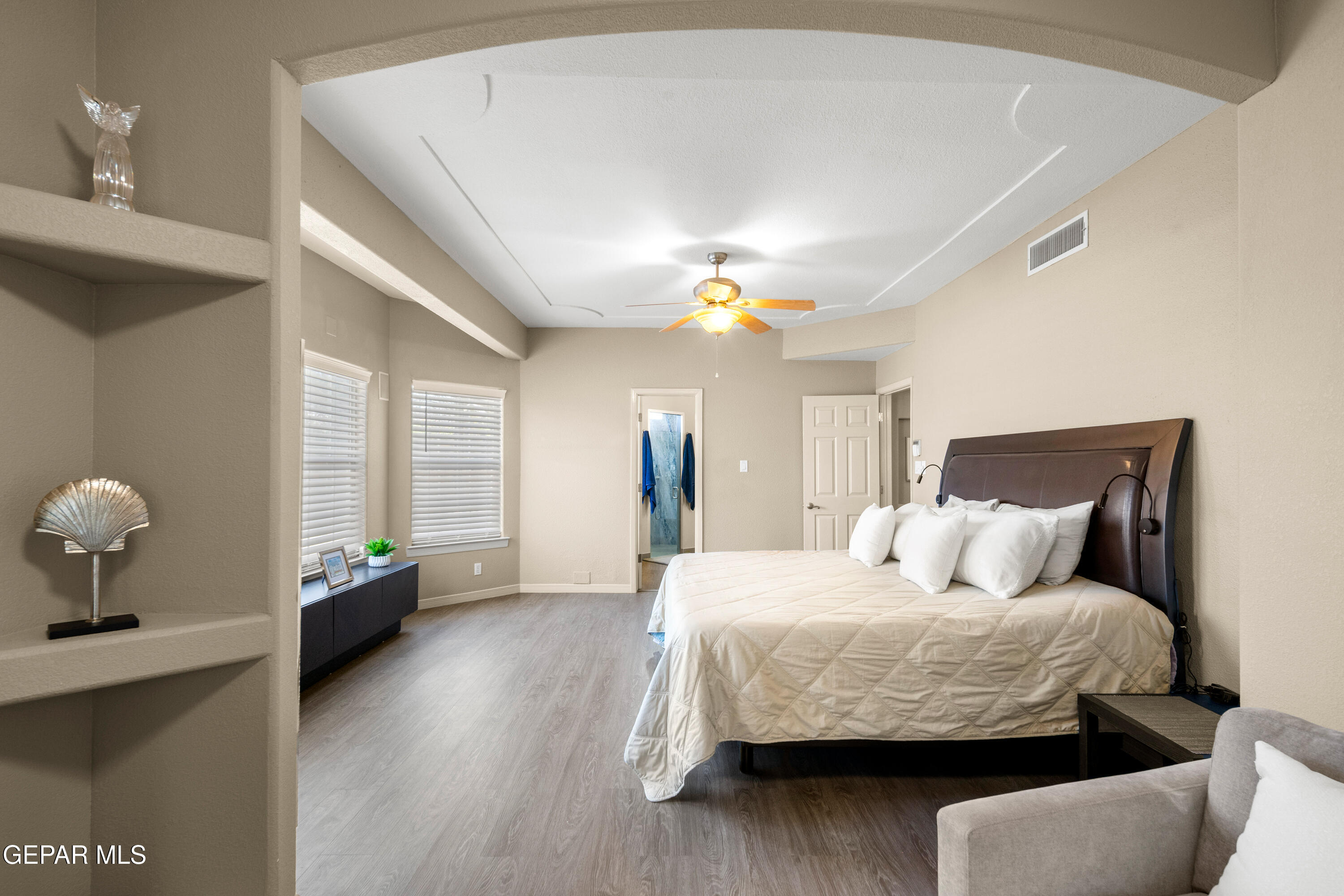 6705 Pearl Ridge Drive El Paso, TX 79912 - Photo 23 of 58 a bedroom with a bed and wooden floor