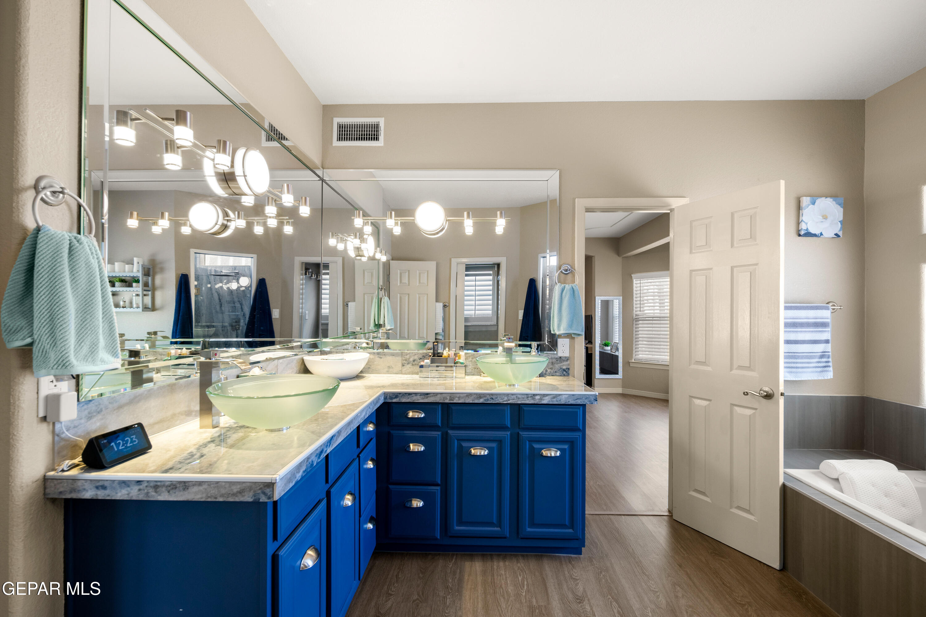 6705 Pearl Ridge Drive El Paso, TX 79912 - Photo 25 of 58 a bathroom with a granite countertop sink mirror and double