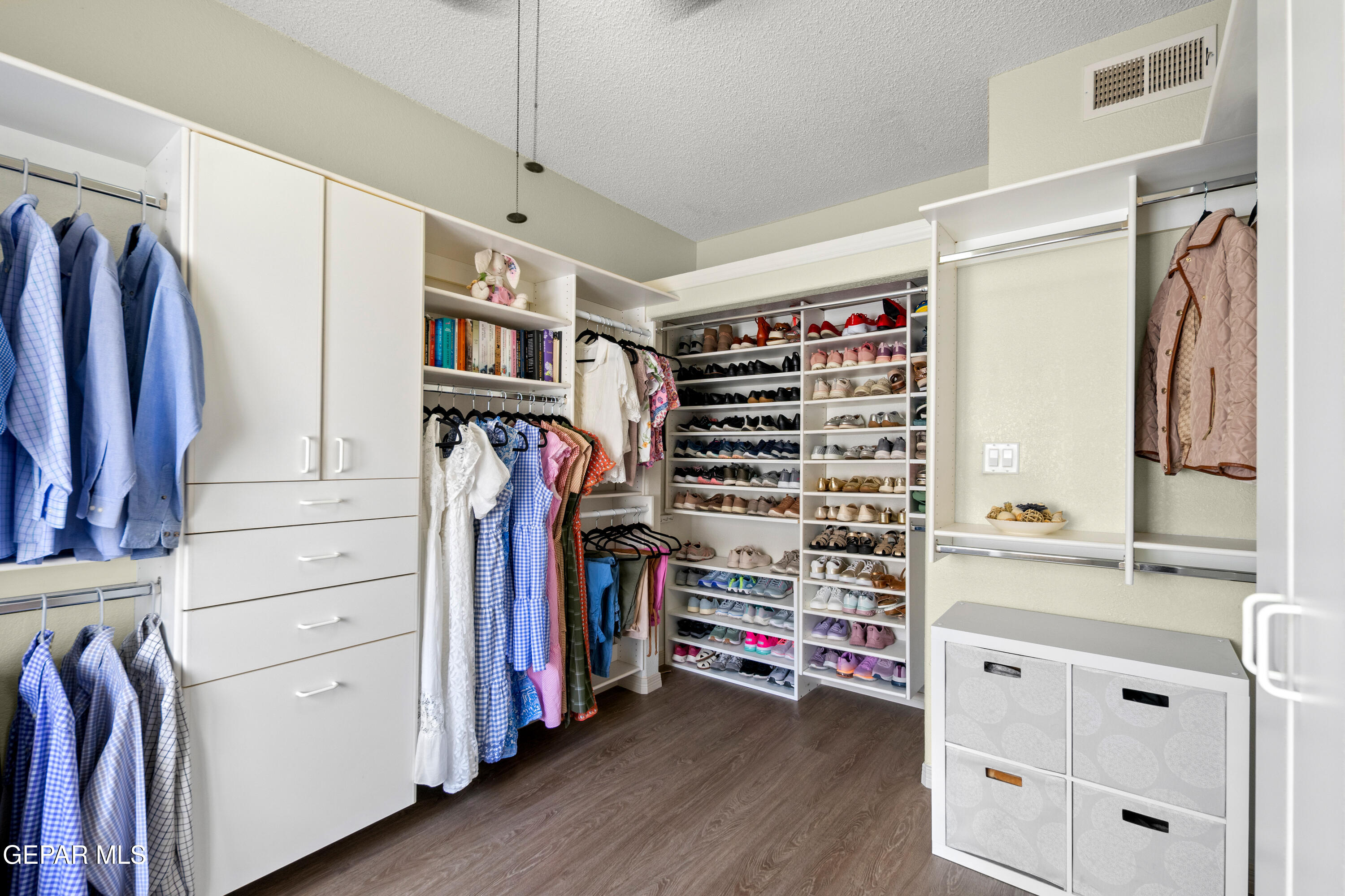 6705 Pearl Ridge Drive El Paso, TX 79912 - Photo 30 of 58 a view of walk in closet with clothes and shoes