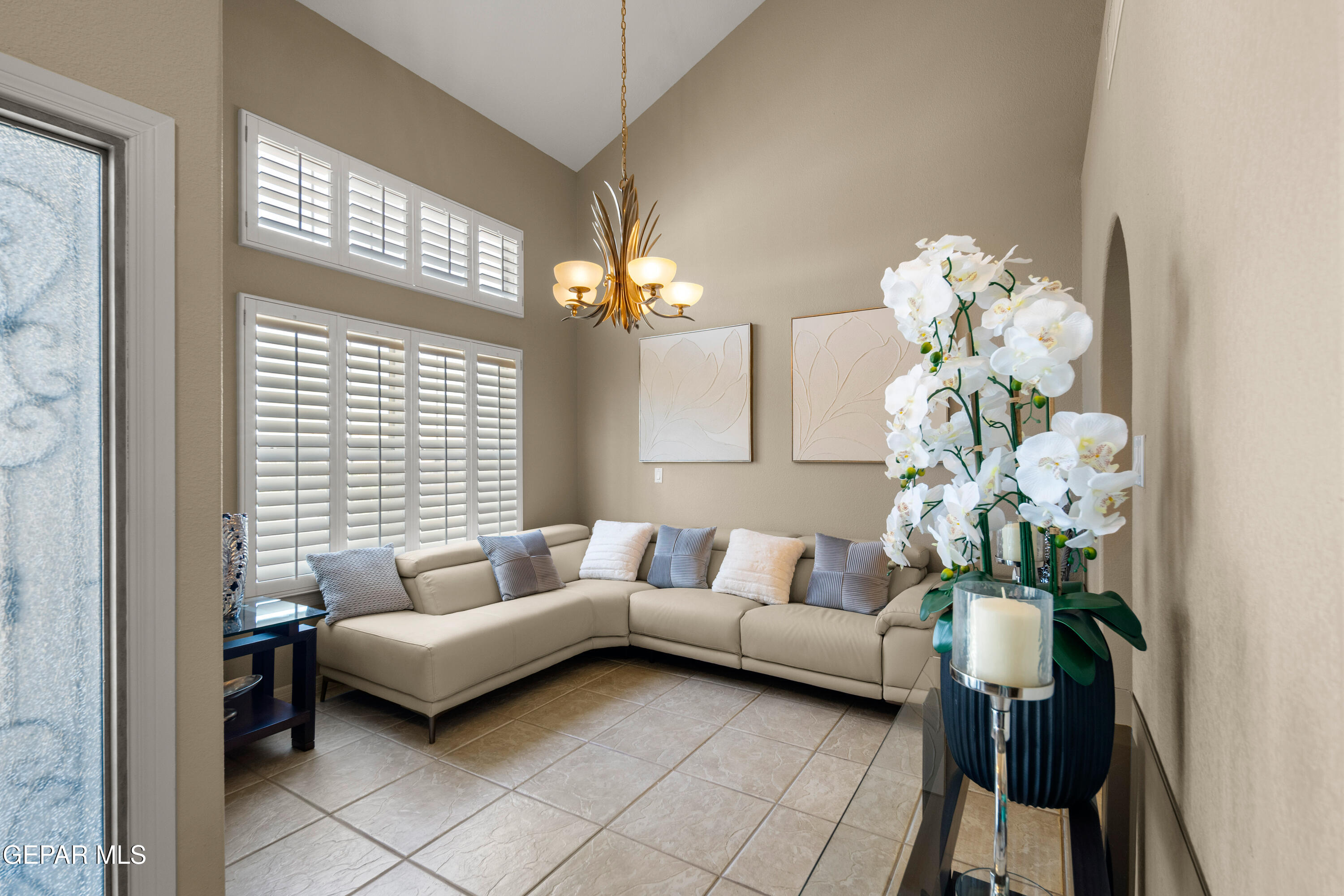 6705 Pearl Ridge Drive El Paso, TX 79912 - Photo 4 of 58 a living room with furniture and a chandelier