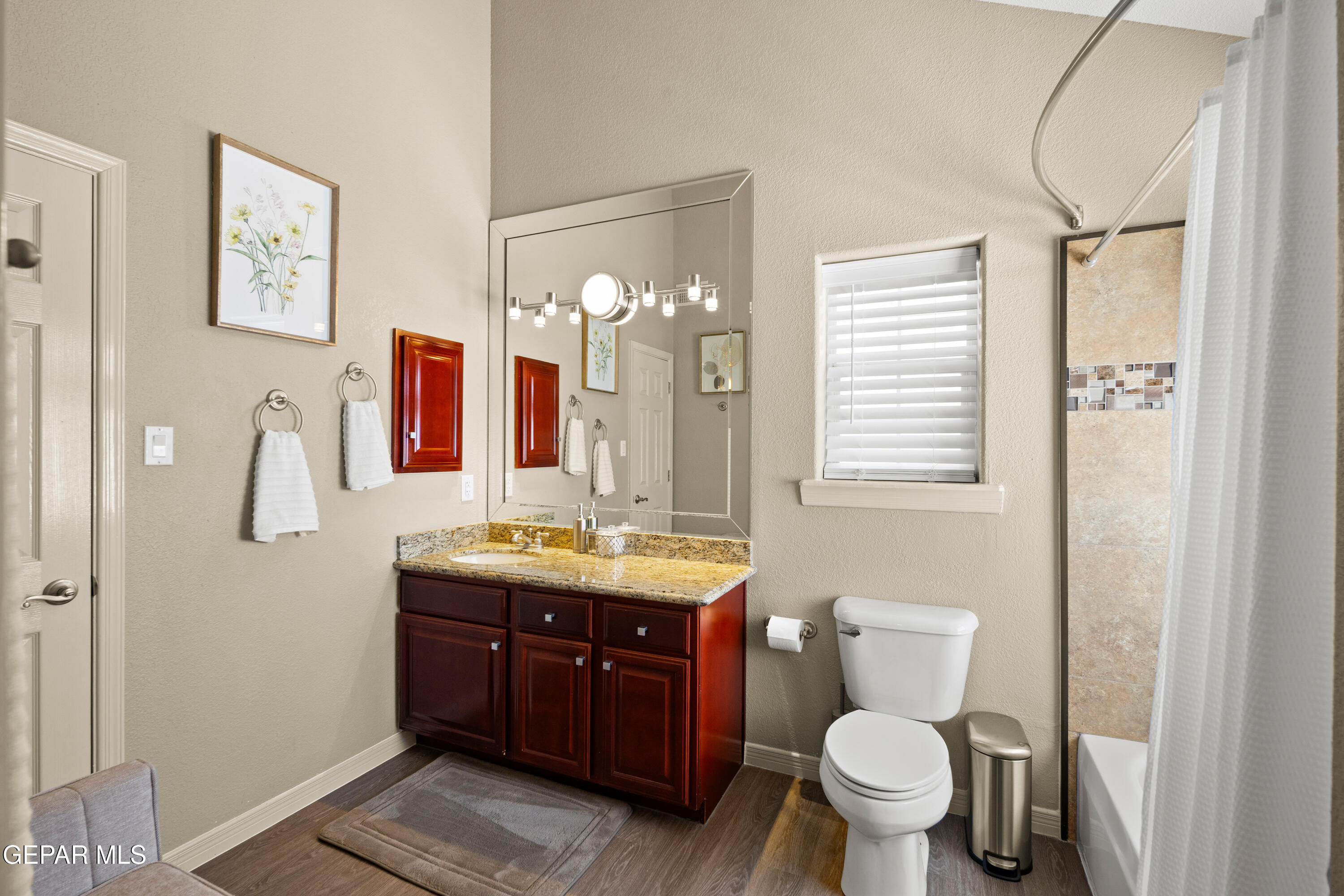 6705 Pearl Ridge Drive El Paso, TX 79912 - Photo 41 of 58 a bathroom with a toilet sink and mirror