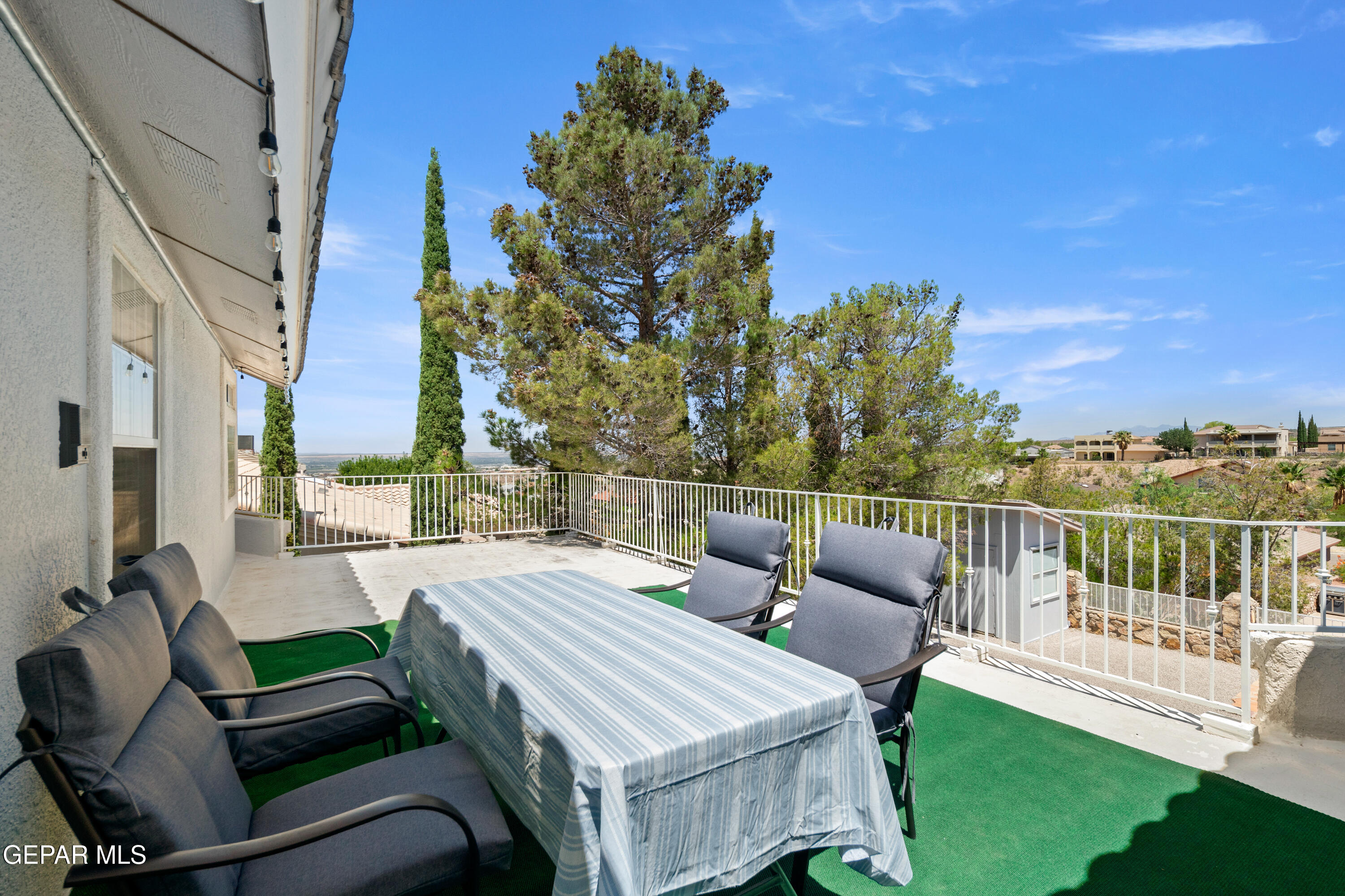 6705 Pearl Ridge Drive El Paso, TX 79912 - Photo 50 of 58 a view of a patio with a table chairs and a table