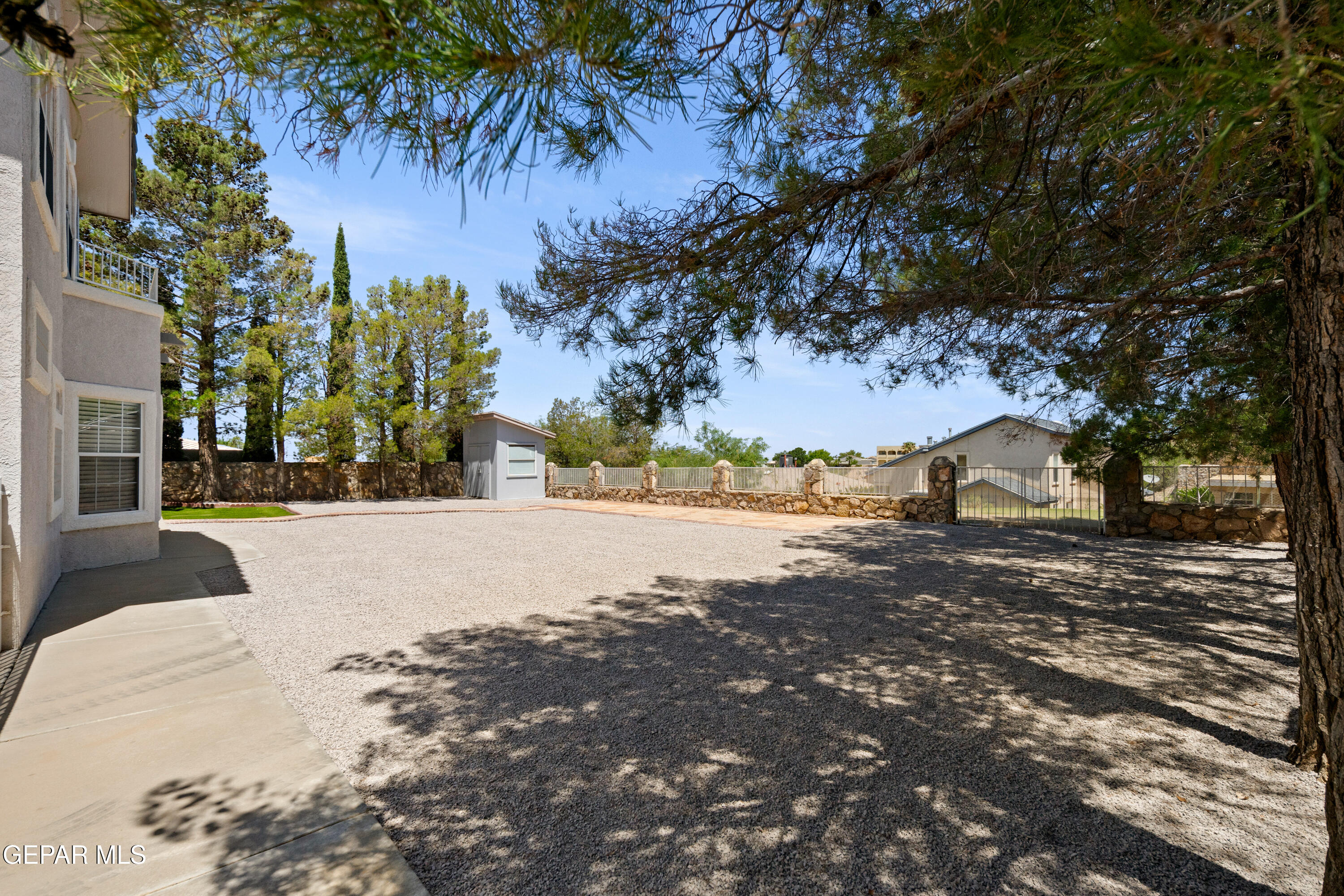 6705 Pearl Ridge Drive El Paso, TX 79912 - Photo 54 of 58 a view of road with large trees