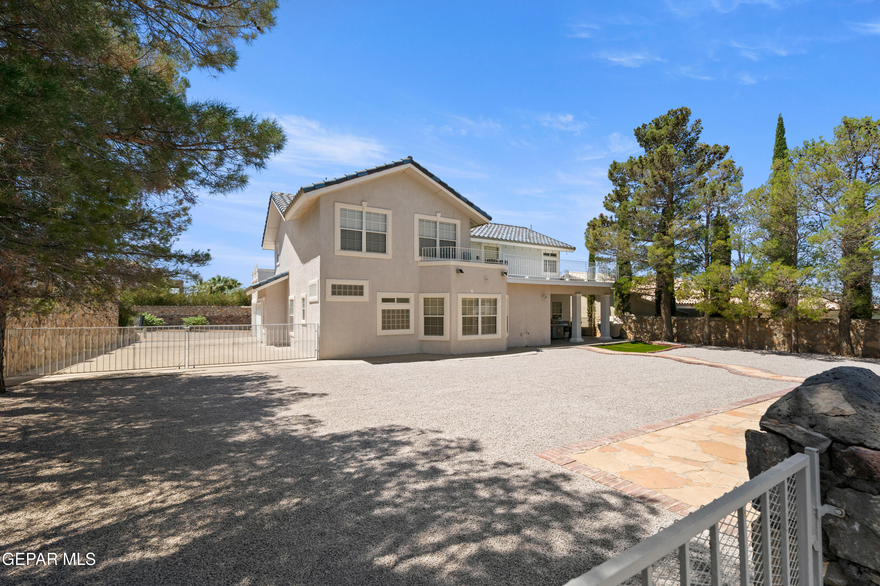 6705 Pearl Ridge Drive El Paso, TX 79912 - Photo 57 of 58 a front view of a house with a yard