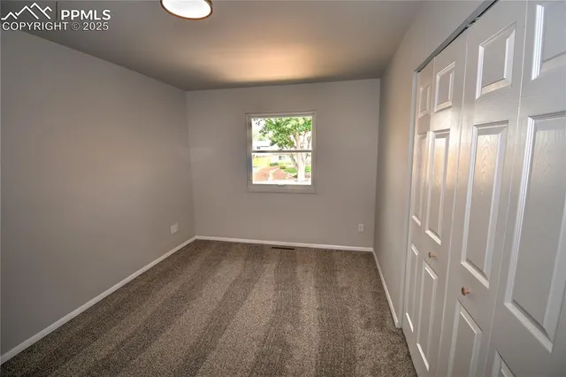 a bathroom with a granite countertop tub sink and mirror