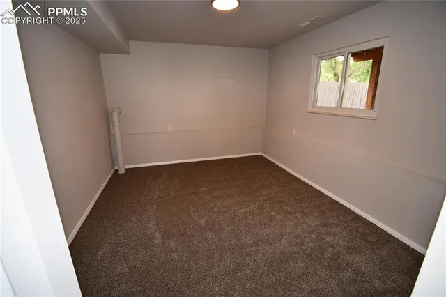 a bathroom with a sink toilet and a window