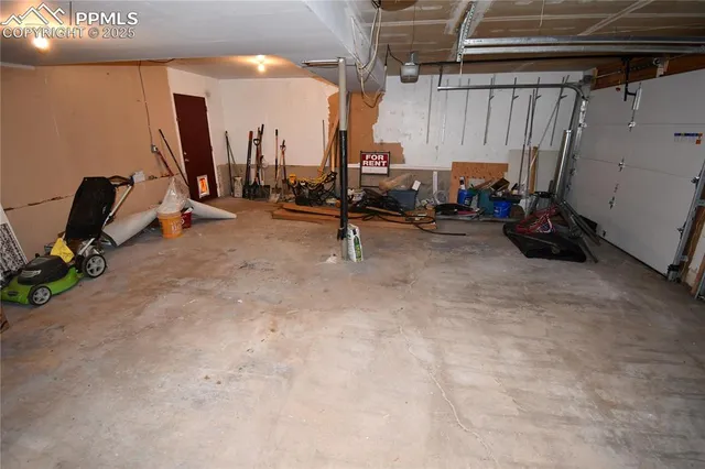 a view of a chairs and table in the backyard
