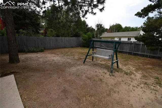 a view of backyard with furniture