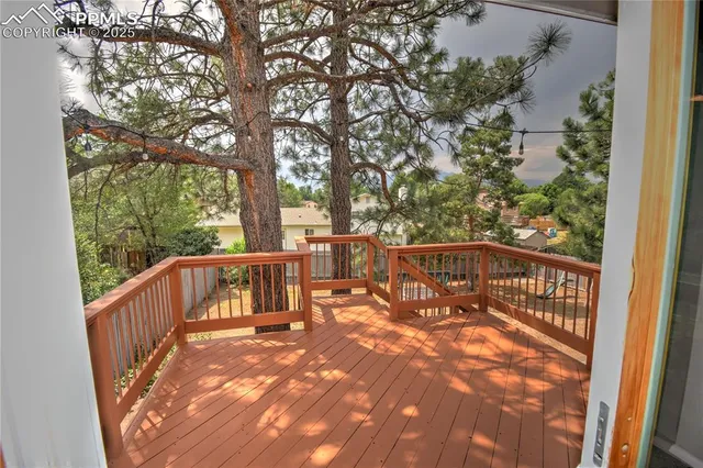 a view of balcony with wooden floor