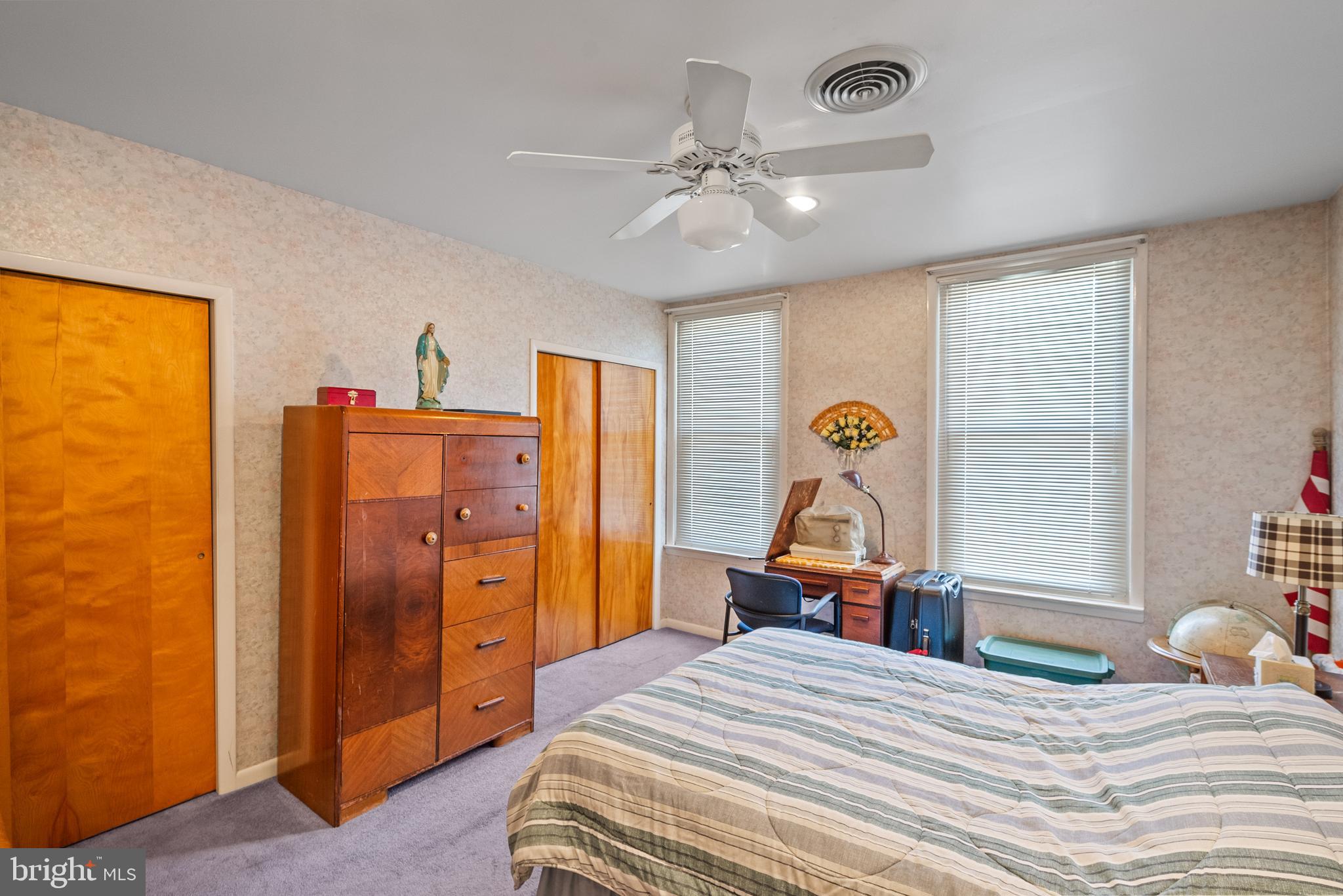 3313 Edgemont Street Philadelphia, PA 19134 - Photo 12 of 22 a bedroom with a bed and chandelier