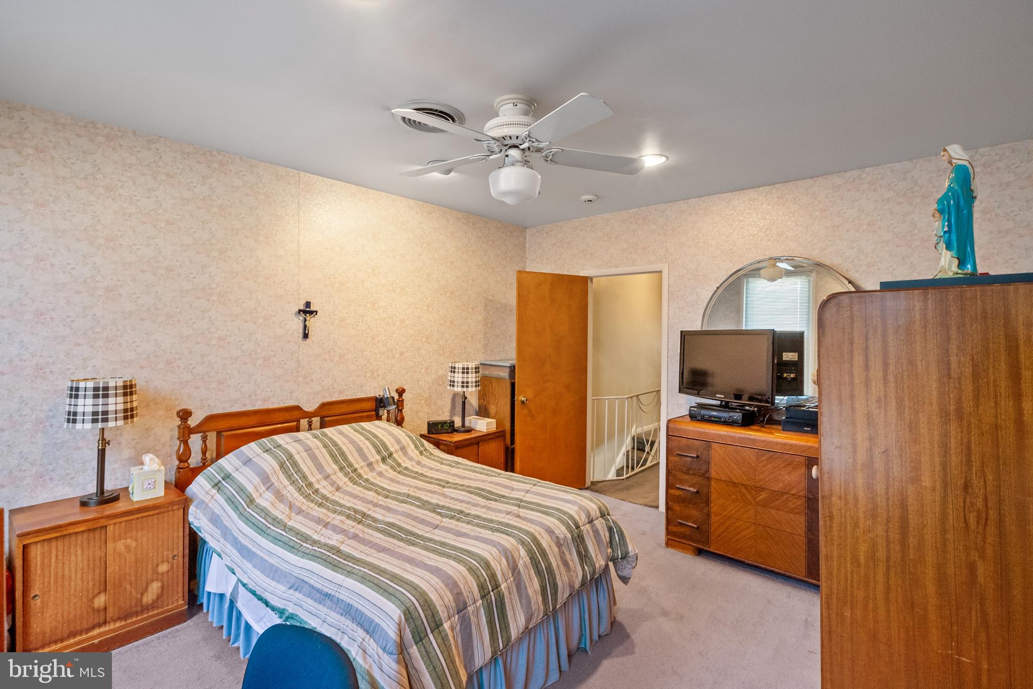 3313 Edgemont Street Philadelphia, PA 19134 - Photo 13 of 22 a bedroom with a bed and a flat screen tv