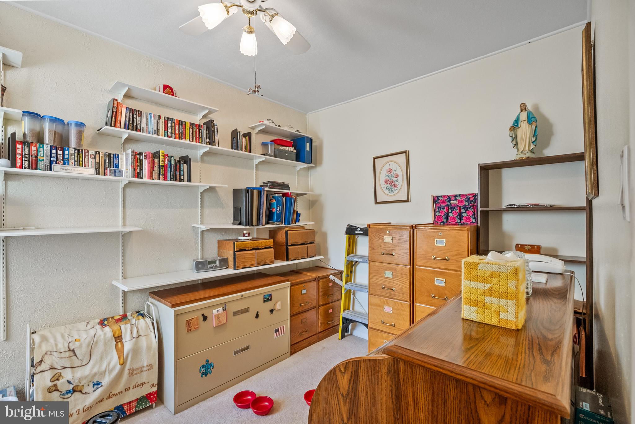 3313 Edgemont Street Philadelphia, PA 19134 - Photo 14 of 22 a bedroom with furniture and a book shelf