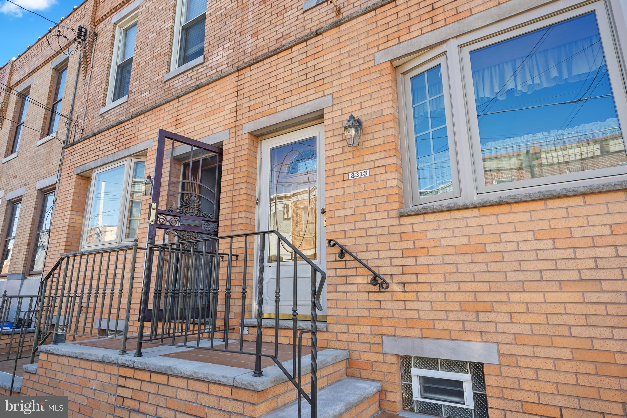 3313 Edgemont Street Philadelphia, PA 19134 - Photo 2 of 22 a view of a brick house with many windows
