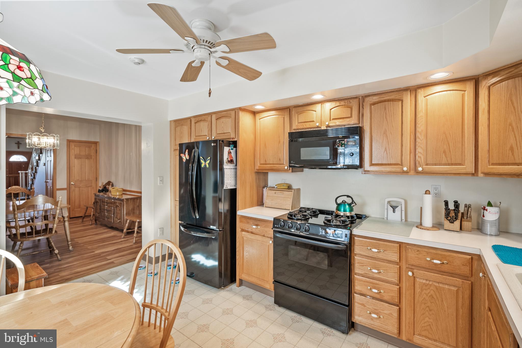 3313 Edgemont Street Philadelphia, PA 19134 - Photo 5 of 22 a kitchen with stainless steel appliances granite countertop a refrigerator stove and sink