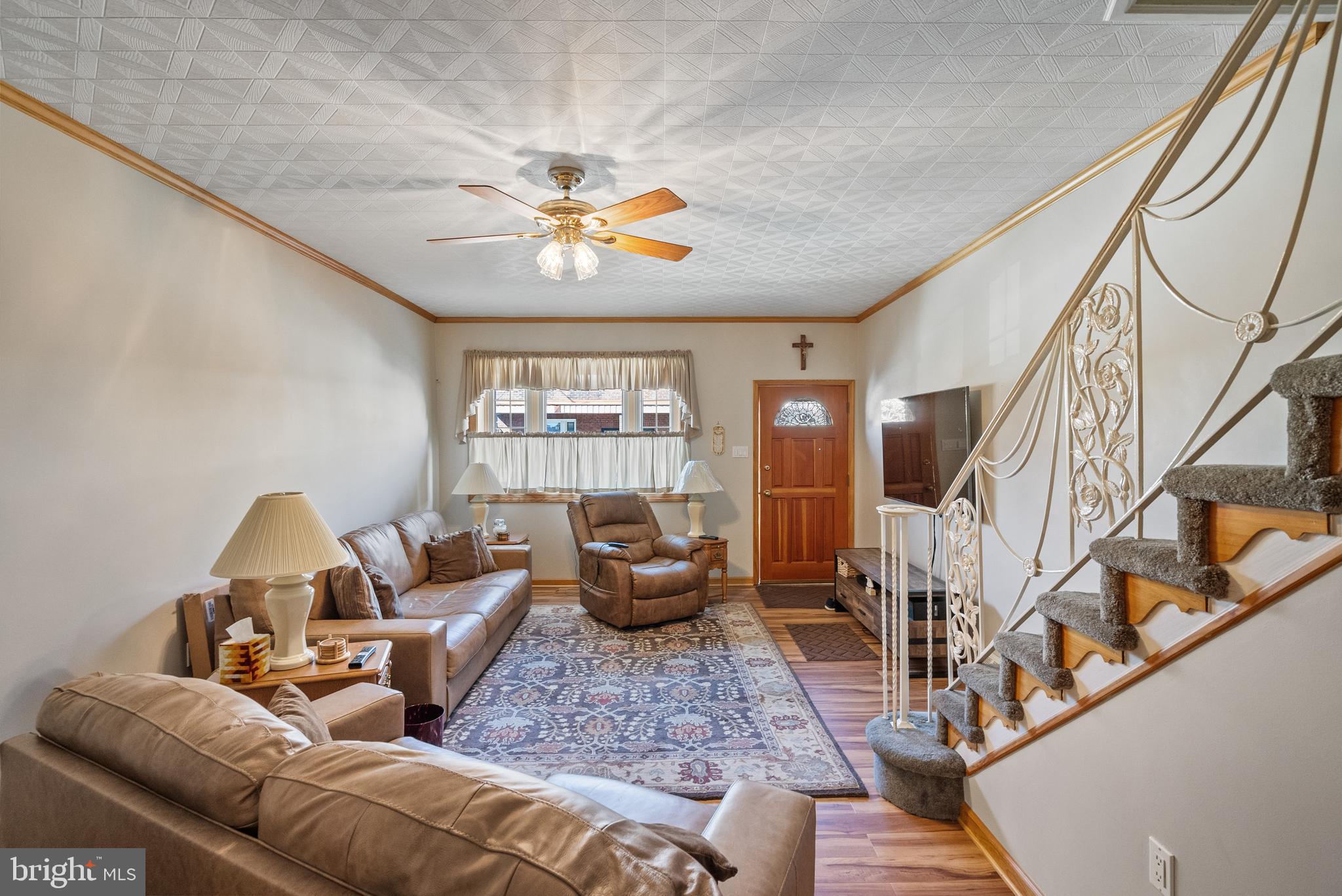 3313 Edgemont Street Philadelphia, PA 19134 - Photo 7 of 22 a living room with furniture and a chandelier