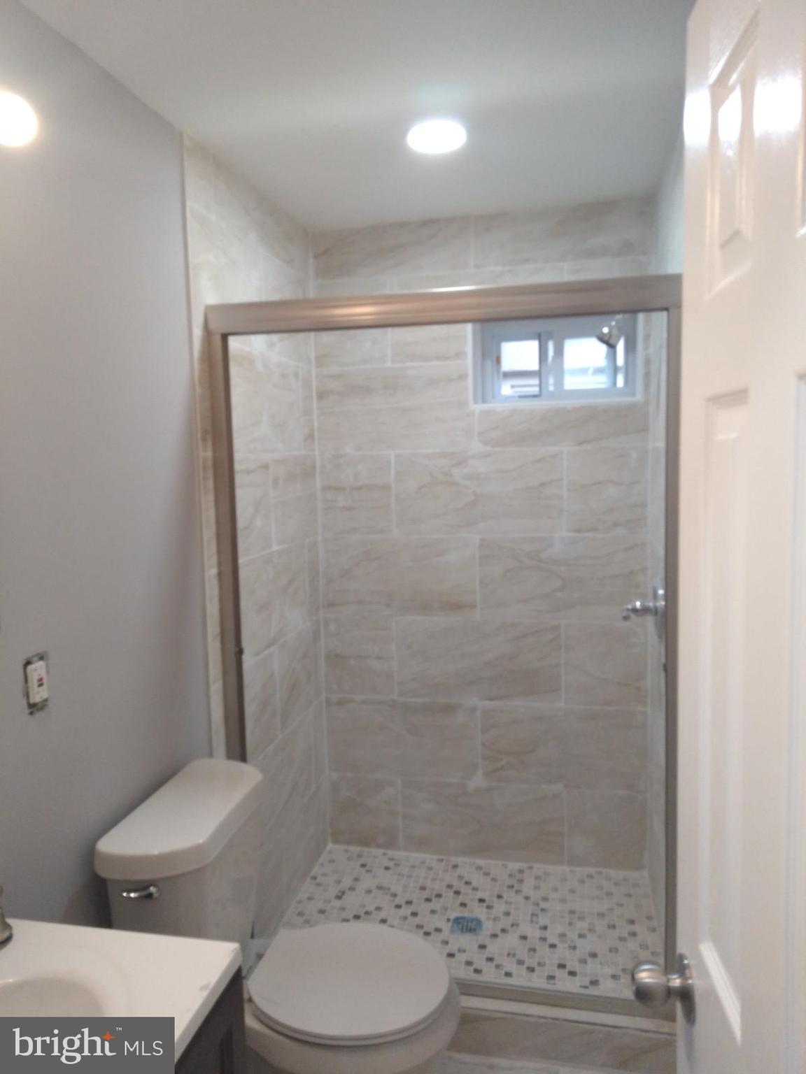 3957 Wallace Street Philadelphia, PA 19104 - Photo 12 of 12 a bathroom with a toilet and a shower