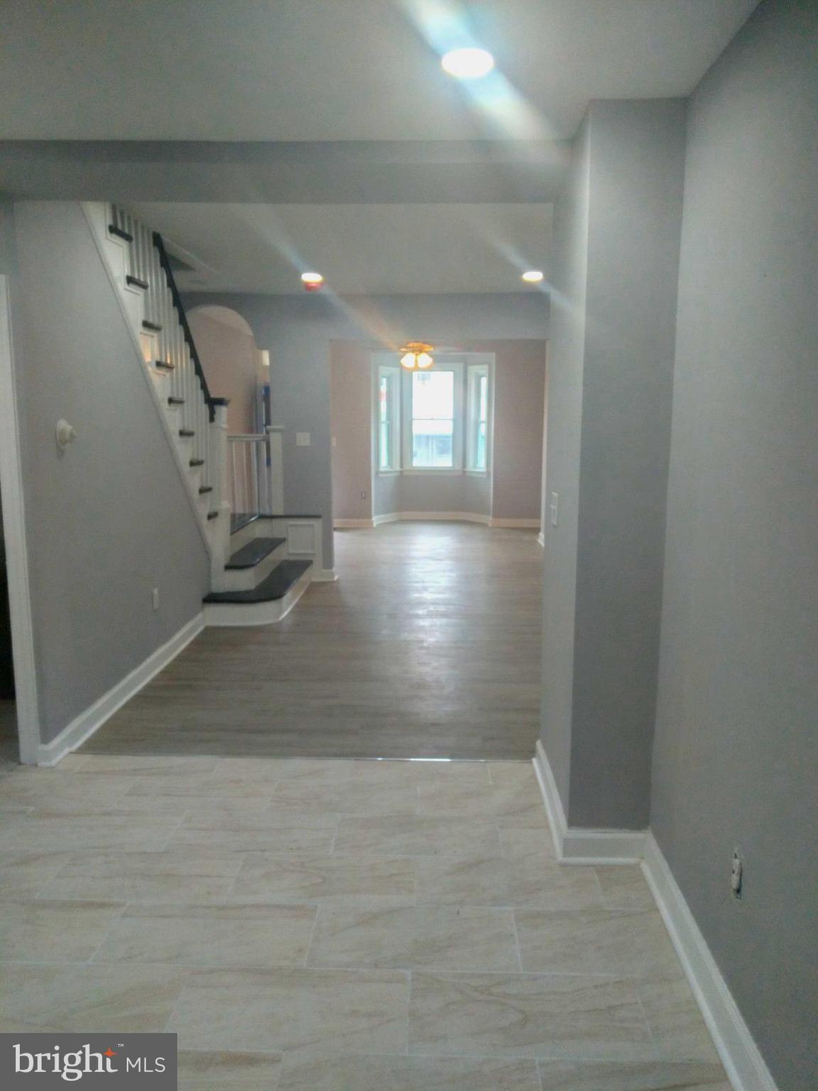 3957 Wallace Street Philadelphia, PA 19104 - Photo 2 of 12 a view of a hallway with wooden floor