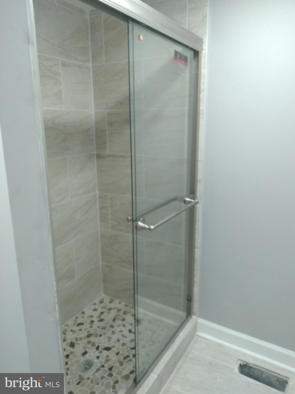 3957 Wallace Street Philadelphia, PA 19104 - Photo 6 of 12 a bathroom with a shower
