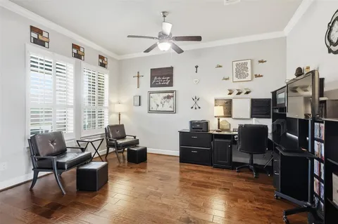 a living room with furniture window and wooden floor
