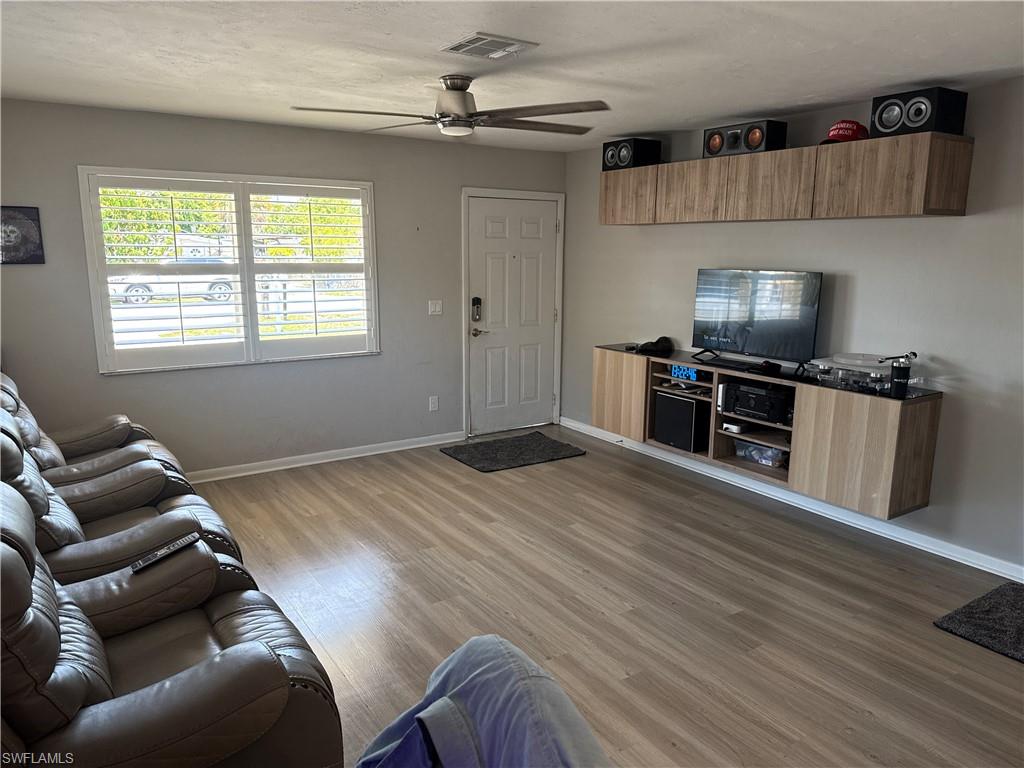 a room with furniture and a flat screen tv