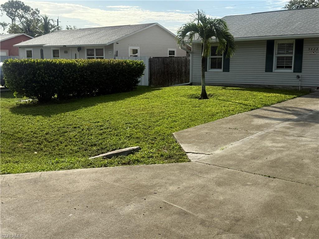 5422 Hardee Street Naples, FL 34113 - Photo 11 of 16 a house view with a garden space