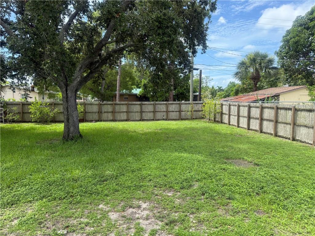 5422 Hardee Street Naples, FL 34113 - Photo 13 of 16 a view of a backyard with a trees