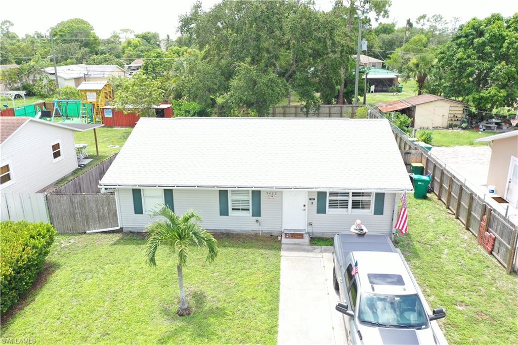 5422 Hardee Street Naples, FL 34113 - Photo 15 of 16 a view of yard and swimming pool