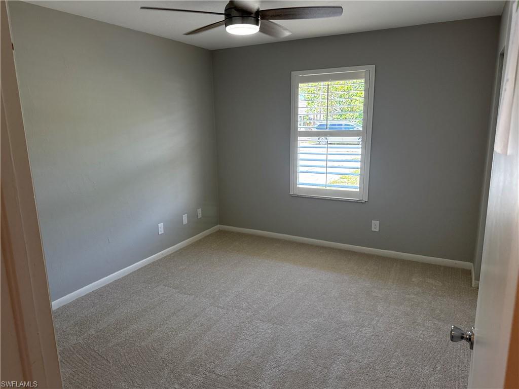 5422 Hardee Street Naples, FL 34113 - Photo 6 of 16 an empty room with a window