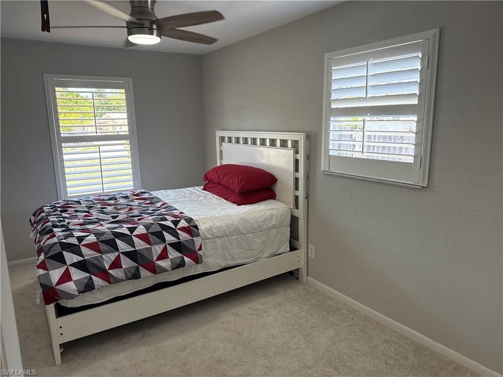 5422 Hardee Street Naples, FL 34113 - Photo 7 of 16 a bedroom with a bed and window