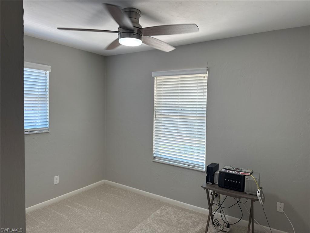 5422 Hardee Street Naples, FL 34113 - Photo 8 of 16 a room with a window and a ceiling fan