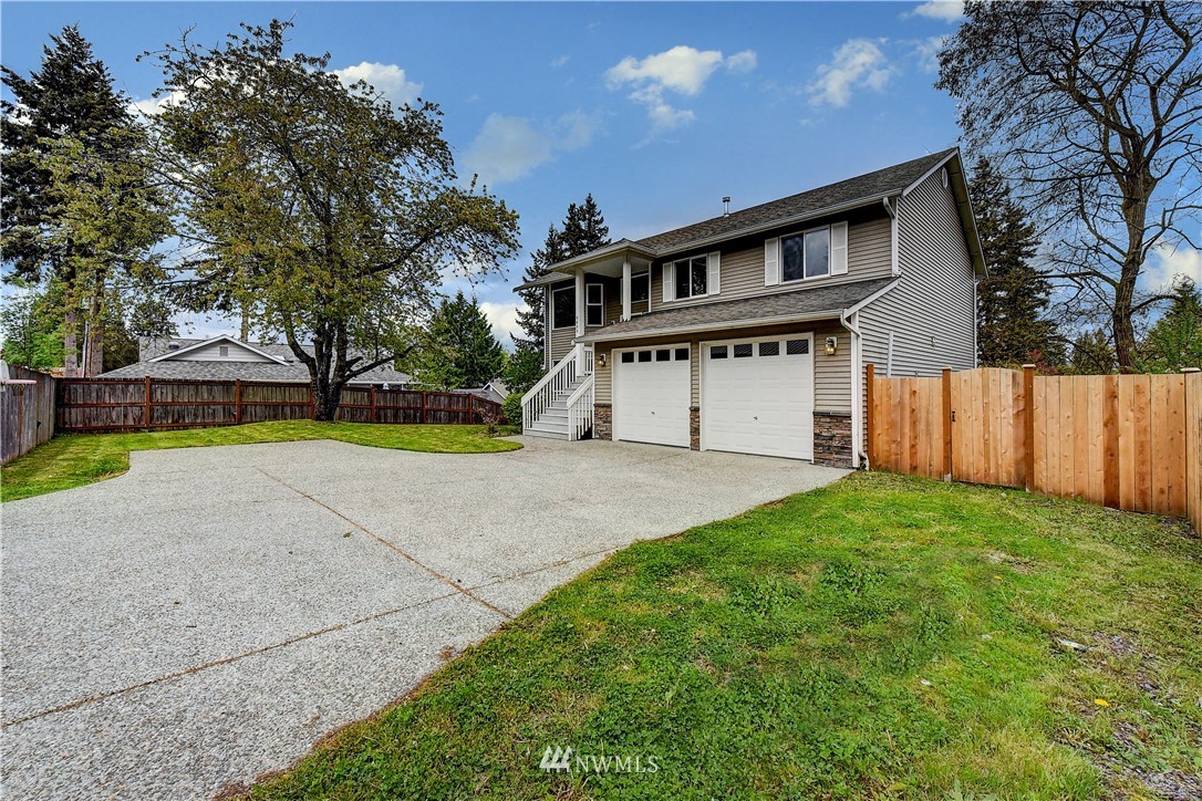 6605 Cady Road Everett, WA 98203 - Photo 2 of 26 a view of house with outdoor space and swimming pool