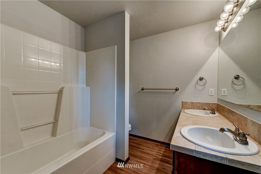 6605 Cady Road Everett, WA 98203 - Photo 14 of 26 a bathroom with a sink and a mirror