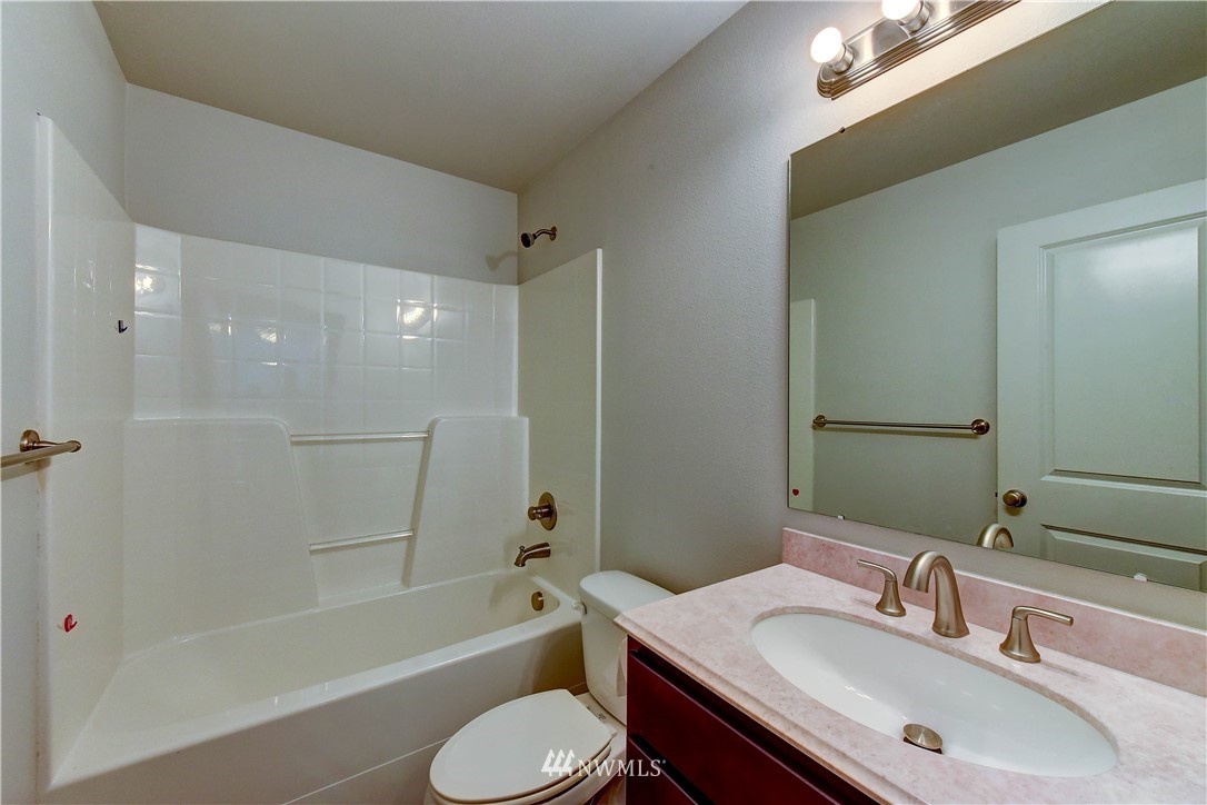 6605 Cady Road Everett, WA 98203 - Photo 16 of 26 a bathroom with a sink toilet tub and shower
