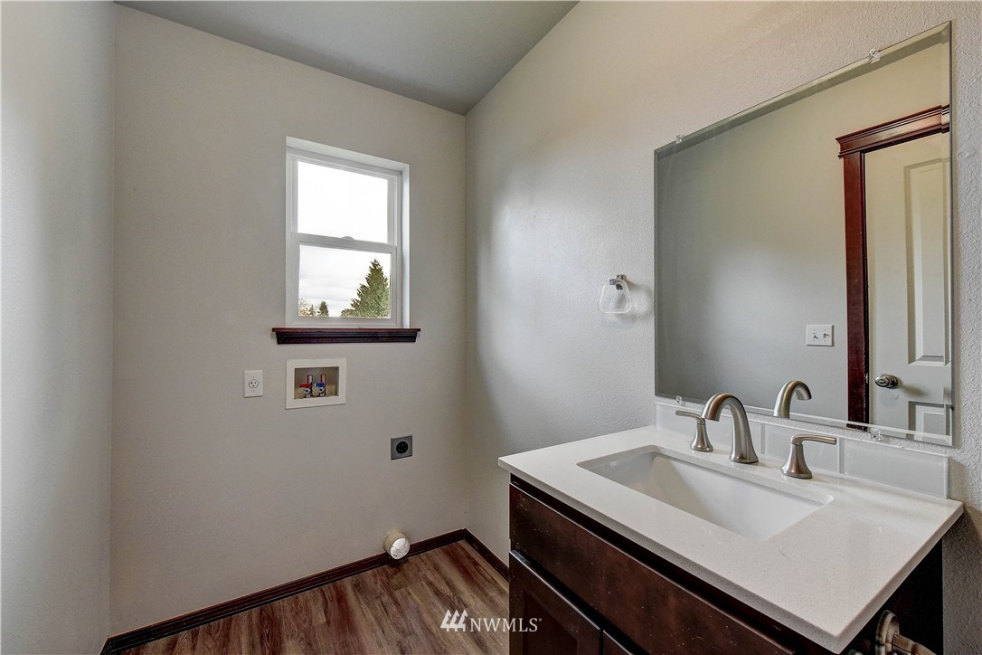6605 Cady Road Everett, WA 98203 - Photo 20 of 26 a bathroom with a sink and a mirror