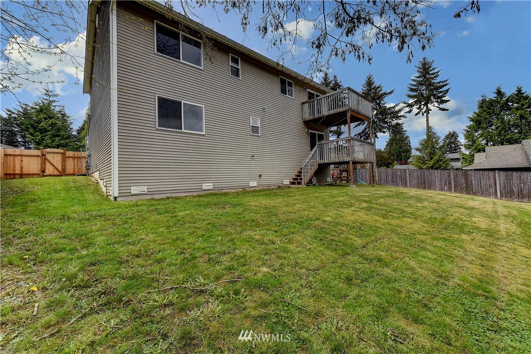 6605 Cady Road Everett, WA 98203 - Photo 26 of 26 a view of a backyard with plants and large tree