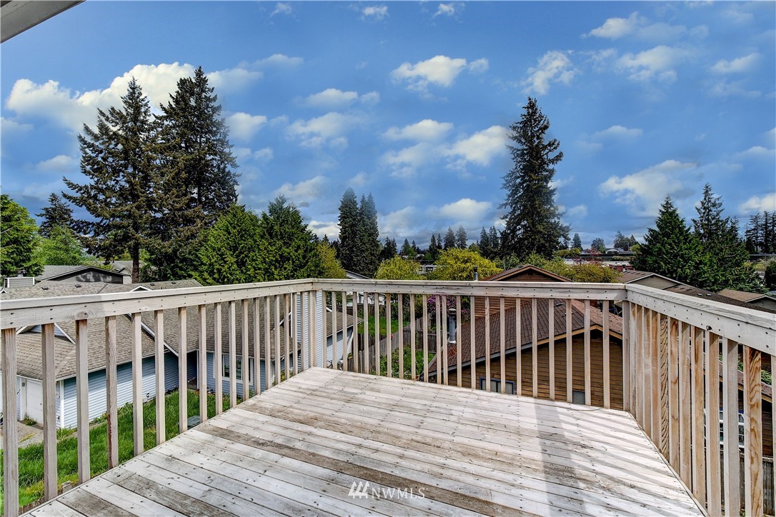 6605 Cady Road Everett, WA 98203 - Photo 8 of 26 a balcony with wooden floor and fence