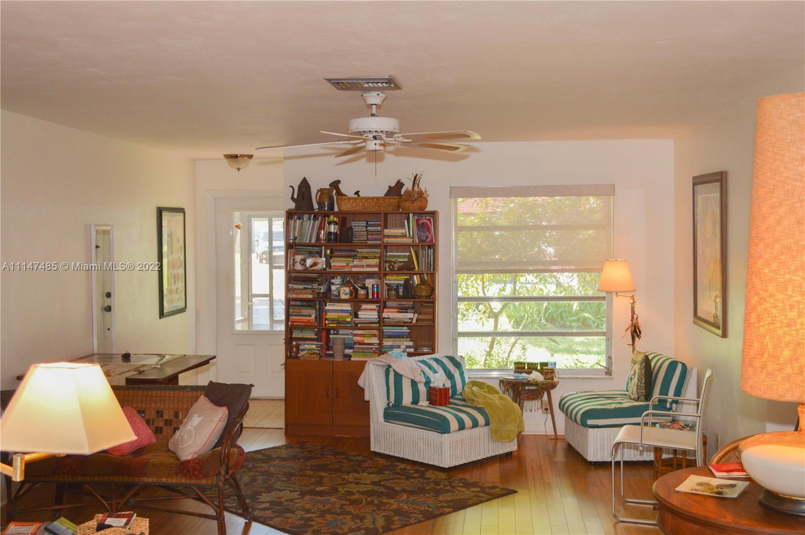 305 Northwest 42nd Street Boca Raton, FL 33431 - Photo 4 of 23 a living room with furniture and a large window
