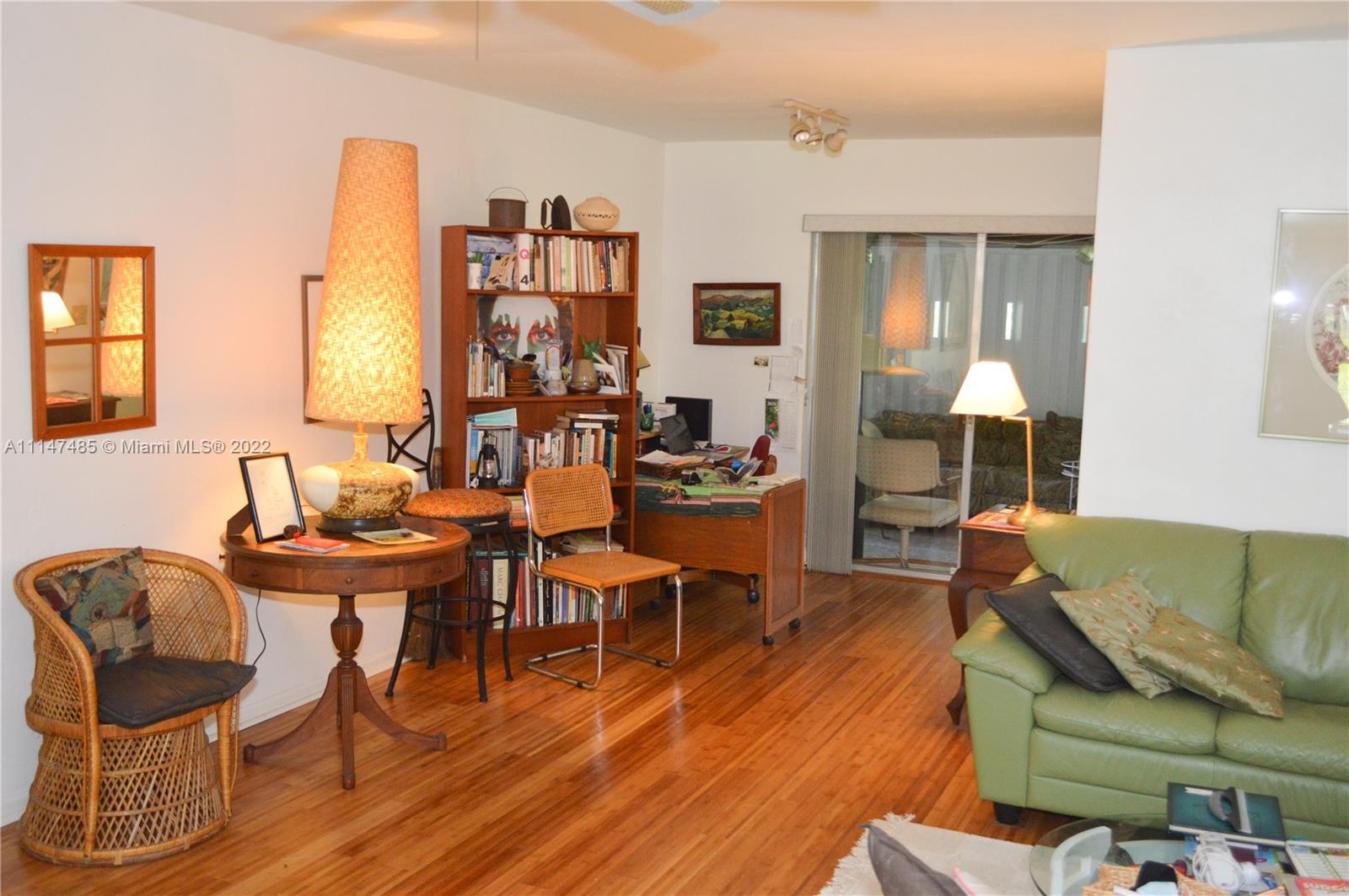 305 Northwest 42nd Street Boca Raton, FL 33431 - Photo 5 of 23 a living room with furniture and wooden floor